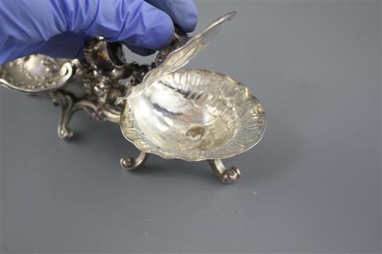 An 18th century French rococco white metal double salt, with hinged covers, on scrolling feet, marks quite rubbed, 18.3cm, 12.5oz,